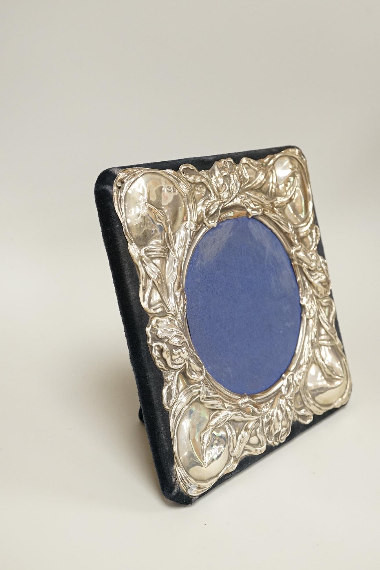 An Edwardian Art Nouveau silver mounted square photograph frame, by William Hair Haseler, Birmingham, 1904, 16cm by 16cm (later backing).